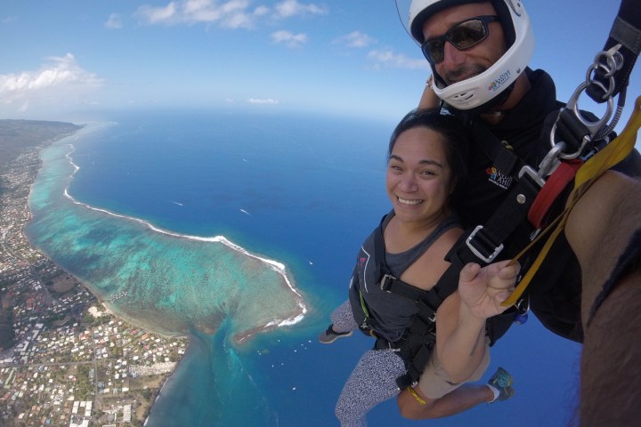 a person standing next to a body of water